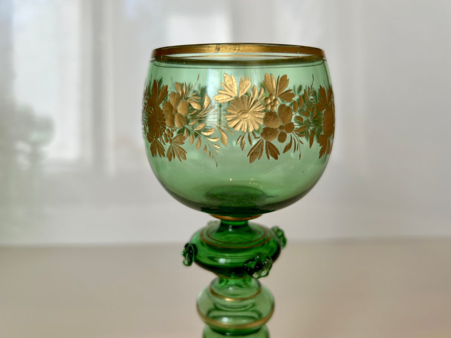 Four Continental Engraved and Gilt Green Glass Roemers, c.1900